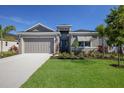 Single-story home with two-car garage and nicely landscaped yard at 12390 Cedar Pass Trl, Parrish, FL 34219