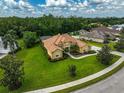 Sprawling single-Gathering home features lush lawns, a screen enclosed patio, and a long driveway at 14526 17Th E Ave, Bradenton, FL 34212