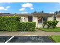 Front view of a light beige townhouse with green landscaping at 2903 60Th W St, Bradenton, FL 34209