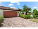 Attached garage with paver driveway at 6506 Candlestick Dr, Bradenton, FL 34212