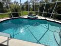 Relaxing screened-in pool and spa area at 139 Long Meadow Lane Ln, Rotonda West, FL 33947