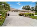House with attached two car garage and landscaped yard at 4113 Putter Pl, Bradenton, FL 34203