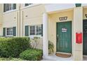Green front door with columns and landscaping at 341 Cape Harbour Loop # 105, Bradenton, FL 34212