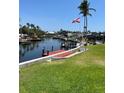 Canal-front property boasts a long dock and lush green backyard at 5111 Coral Blvd, Bradenton, FL 34210