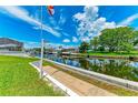 Scenic waterfront view with a concrete walkway and lush greenery along the canal at 5111 Coral Blvd, Bradenton, FL 34210