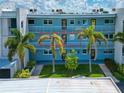 Exterior view of condo building, highlighting a specific unit at 12405 3Rd E St # 206, Treasure Island, FL 33706