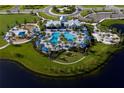 Aerial view of community pool, playground and clubhouse at 10145 Spruce River Way, Parrish, FL 34219