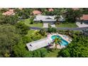 Community pool and surrounding villas aerial view at 3851 Wilshire Dr # 9, Sarasota, FL 34238