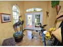 Bright entryway with tile floor, French doors, and decorative accents at 2107 89Th St Nw, Bradenton, FL 34209