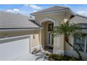 House exterior showcasing a front entrance and landscaping at 7335 Saint Georges Way, University Park, FL 34201