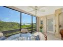 Bright dining area with glass table and chairs, offering scenic views at 826 Bayport Way # 826, Longboat Key, FL 34228