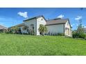 Single Gathering home with lush green grass, landscape, a two-car garage and tile roof at 109 Corserra Dr, Nokomis, FL 34275