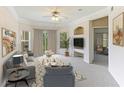 Spacious living room with large windows and comfy furniture at 5140 Northridge Rd # 208, Sarasota, FL 34238