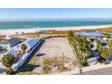 Oceanfront lot with neighboring houses at 769 North Shore Dr, Anna Maria, FL 34216