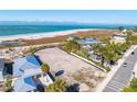Oceanfront lot with neighboring houses at 769 North Shore Dr, Anna Maria, FL 34216