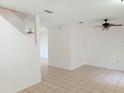 Open living room with high ceilings and ceiling fans at 6209 Flagfish Ct, Lakewood Ranch, FL 34202