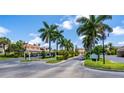 Palm trees line the driveway leading to the building at 6101 34Th W St # 1D, Bradenton, FL 34210