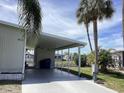 Covered carport with concrete parking area at 614 Cervina Dr, Venice, FL 34285