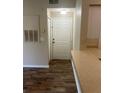 Condo entryway with new flooring and neutral walls at 4102 Central Sarasota Pkwy # 922, Sarasota, FL 34238