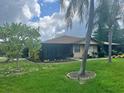 Condo with a screened porch and landscaped yard at 4210 66Th Street W Cir, Bradenton, FL 34209