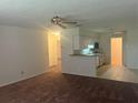 Spacious living room with carpet flooring and neutral walls at 4210 66Th Street W Cir, Bradenton, FL 34209