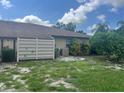 Condo with a fenced patio and landscaped yard at 4210 66Th Street W Cir, Bradenton, FL 34209