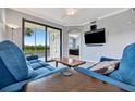 Living room with sectional sofa and view of golf course at 17724 Gawthrop Dr # 201, Bradenton, FL 34211