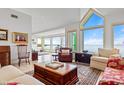 Bright living room with water views, comfortable seating, and large windows at 24 Tidy Island Blvd # 24, Bradenton, FL 34210