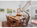 Charming dining room featuring a wood table and chairs, hardwood floors, and artwork at 24 Tidy Island Blvd # 24, Bradenton, FL 34210