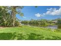 Serene waterfront view with lush greenery and a peaceful atmosphere at 7217 Churston Ln, University Park, FL 34201