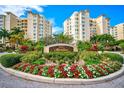 Landscaped entrance to Meridian condos with signage at 393 N Point Rd # 503, Osprey, FL 34229