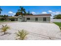 Newly renovated home with a fresh coat of paint, and a palm tree in the front yard at 4312 3Rd Nw Ave, Bradenton, FL 34209