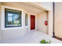 Private entrance with red door and window at 23411 Collina Way # 9102, Port Charlotte, FL 33980