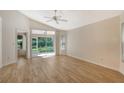 Bright living room with vinyl plank flooring and sliding glass doors at 4072 Fairway Pl, North Port, FL 34287