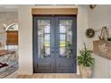 Inviting entryway with double doors and a decorative wreath at 12307 S Access Rd, Port Charlotte, FL 33981