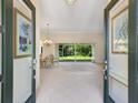 Bright and spacious entryway with double doors leading into the main living area at 6747 Coyote Ridge Ct, Bradenton, FL 34201