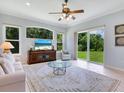 Relaxing Gathering room with large windows, comfortable furniture, and access to backyard at 6747 Coyote Ridge Ct, Bradenton, FL 34201