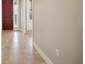 Light and airy entryway with tile flooring and red door at 1048 Bradberry Dr, Nokomis, FL 34275