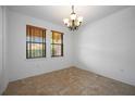 Bright dining room with tile floors and a chandelier at 1048 Bradberry Dr, Nokomis, FL 34275