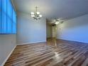 Bright dining room with laminate wood floors and a chandelier at 4480 Ironwood Cir # 305A, Bradenton, FL 34209