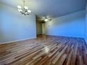 Bright dining room with laminate wood floors and a chandelier at 4480 Ironwood Cir # 305A, Bradenton, FL 34209