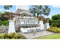Community entrance with stonework and water feature at 12665 Promenade Estates Blvd, Sarasota, FL 34238