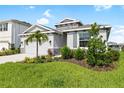 One story house with gray exterior and stone accents at 12665 Promenade Estates Blvd, Sarasota, FL 34238