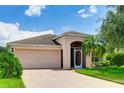 One-story home with attached garage and landscaped yard at 9861 50Th Street E Cir, Parrish, FL 34219