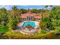 Community pool with lush landscaping, perfect for relaxation and recreation at 4126 Central Sarasota Pkwy # 2026, Sarasota, FL 34238
