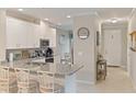 Modern kitchen with granite countertops and stainless steel appliances at 12710 Sorrento Way # 101, Bradenton, FL 34211