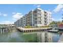 Modern building with waterfront access, boat slips, and kayak storage at 1709 N Tamiami Trl # 221, Sarasota, FL 34234