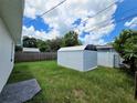 Backyard with storage shed and grassy area at 100 N Duncan Ave, Clearwater, FL 33755