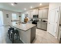 Modern kitchen with granite countertops and island at 10827 Charlotte Dr, Parrish, FL 34219