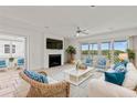 Bright living room with water views, fireplace and comfortable seating at 13 Tidy Island Blvd # 13, Bradenton, FL 34210